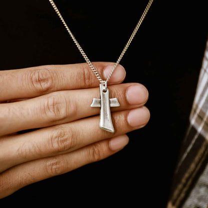 Man wearing Accord Cross necklace handcrafted in antiqued sterling silver with the pendant strung on your choice of chain