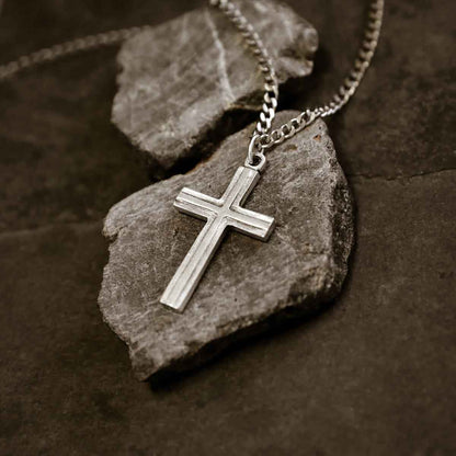 man wearing a pewter Adopted Cross Necklace