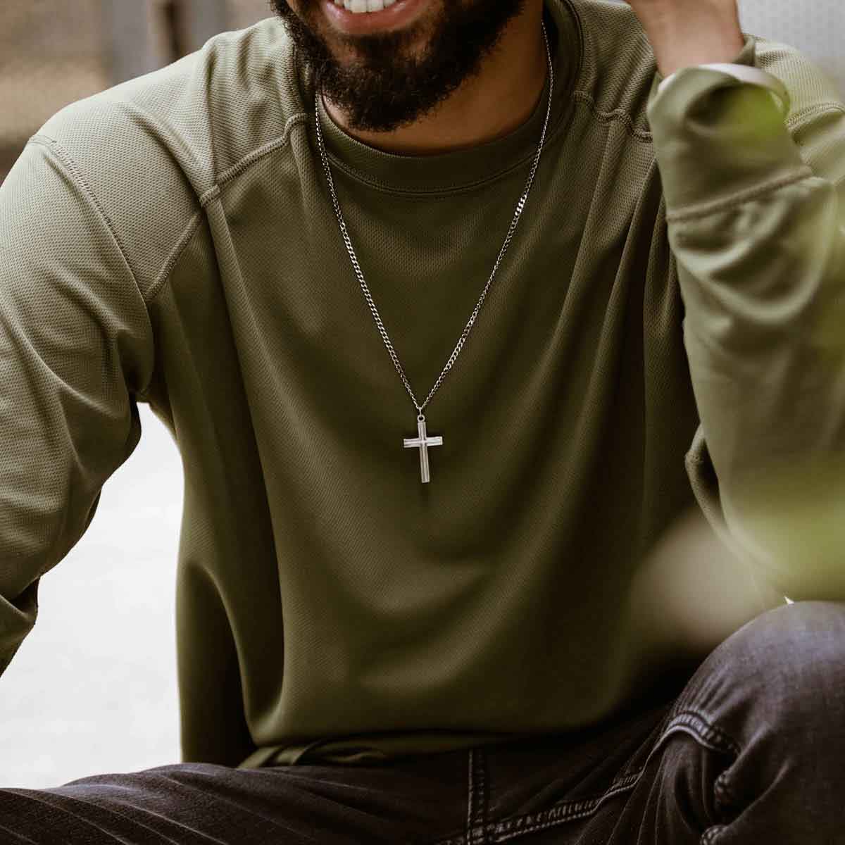 man wearing a pewter Adopted Cross Necklace