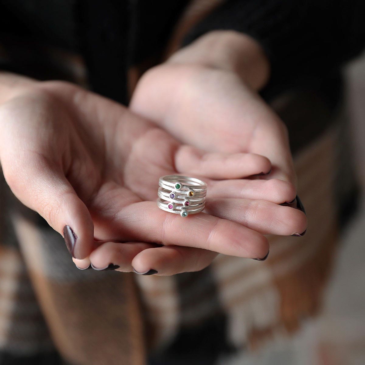 Woman wearing Always together birthstone ring handcrafted in sterling silver set with 3 to 6 birthstones