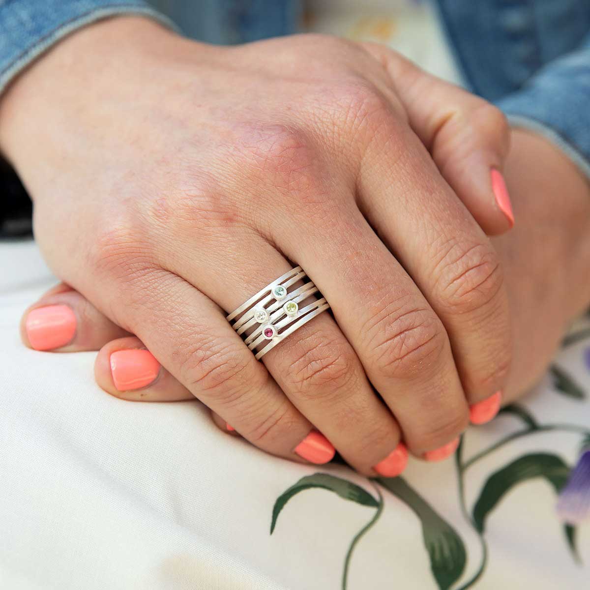 Girl wearing Always together birthstone ring handcrafted in sterling silver set with 3 to 6 birthstones 