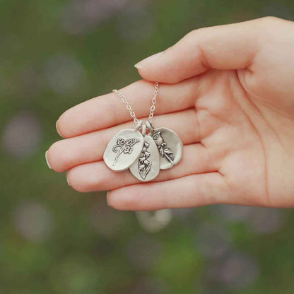 girl wearing a sterling silver April Birth flower necklace