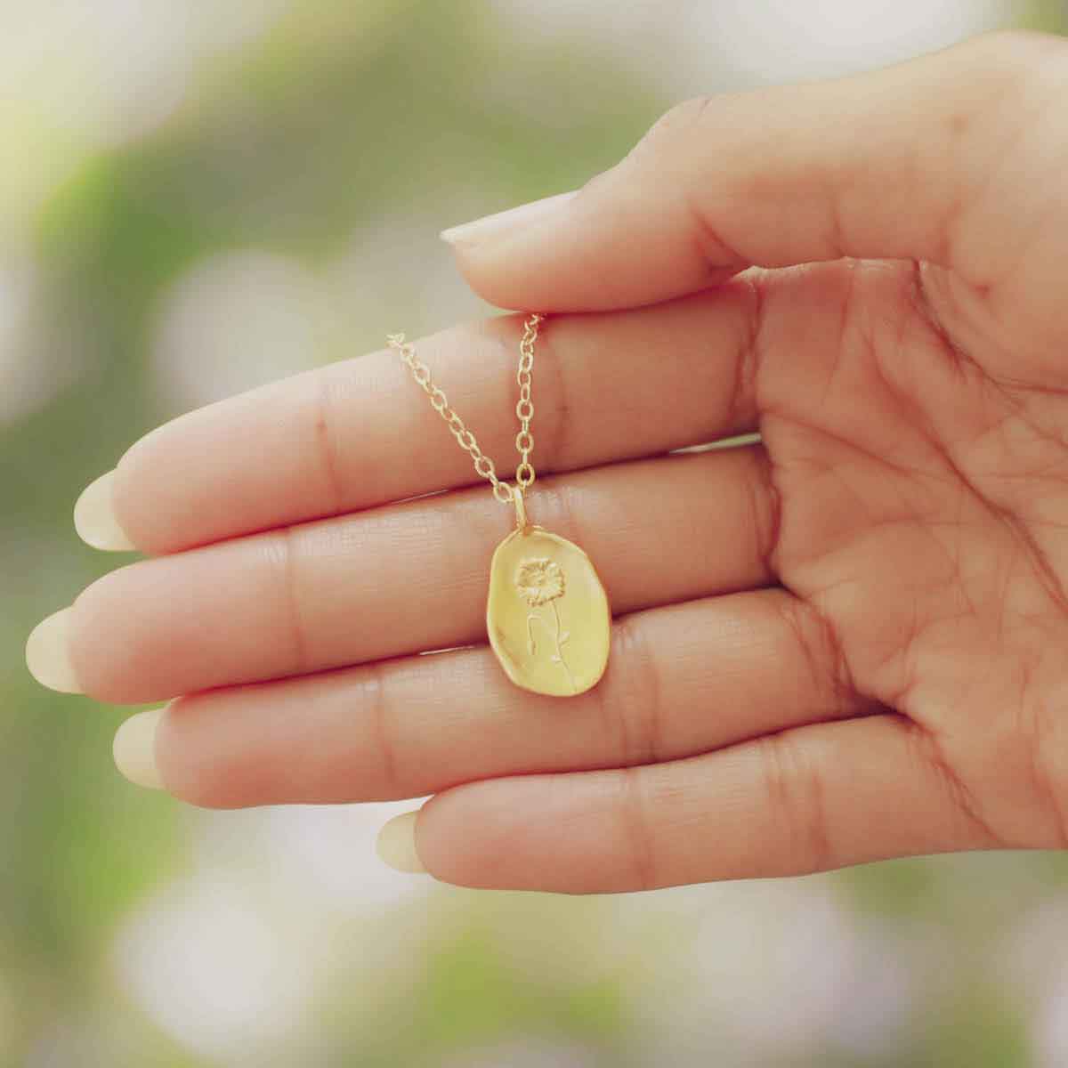 girl wearing a gold plated August birth flower necklace with an 18" gold filled link chain