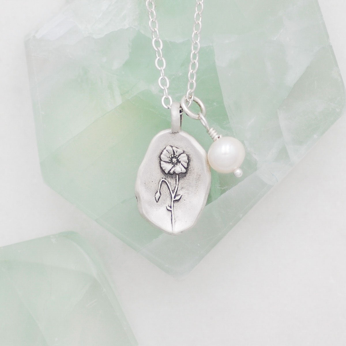 August birth flower necklace handcrafted in sterling silver with a special birth month charm strung with a vintage freshwater pearl