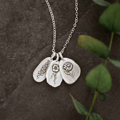 girl wearing a sterling silver August birth flower necklace