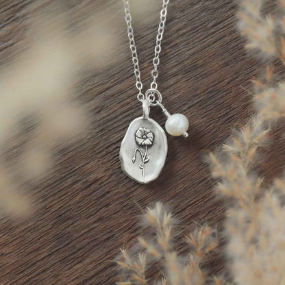 August birth flower necklace handcrafted in sterling silver with a special birth month charm strung with a vintage freshwater pearl