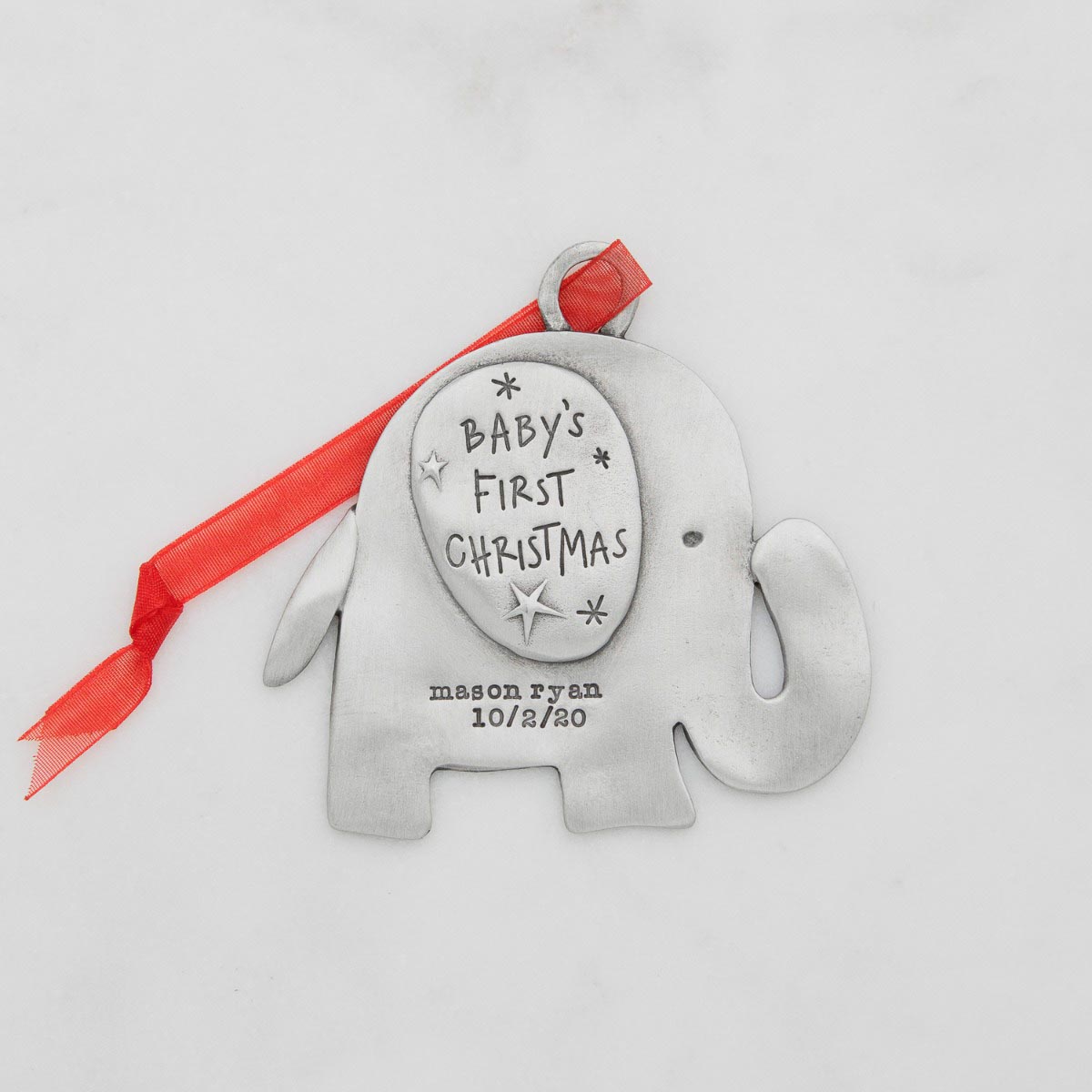 baby's first Christmas ornament of an elephant hand-molded and cast in fine pewter personalized with up to two lines with a name