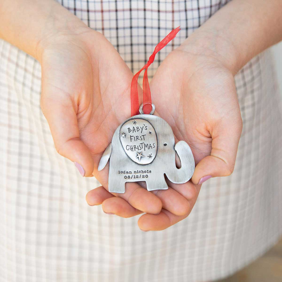 baby's first Christmas ornament of an elephant hand-molded and cast in fine pewter. personalized with up to two lines with a name