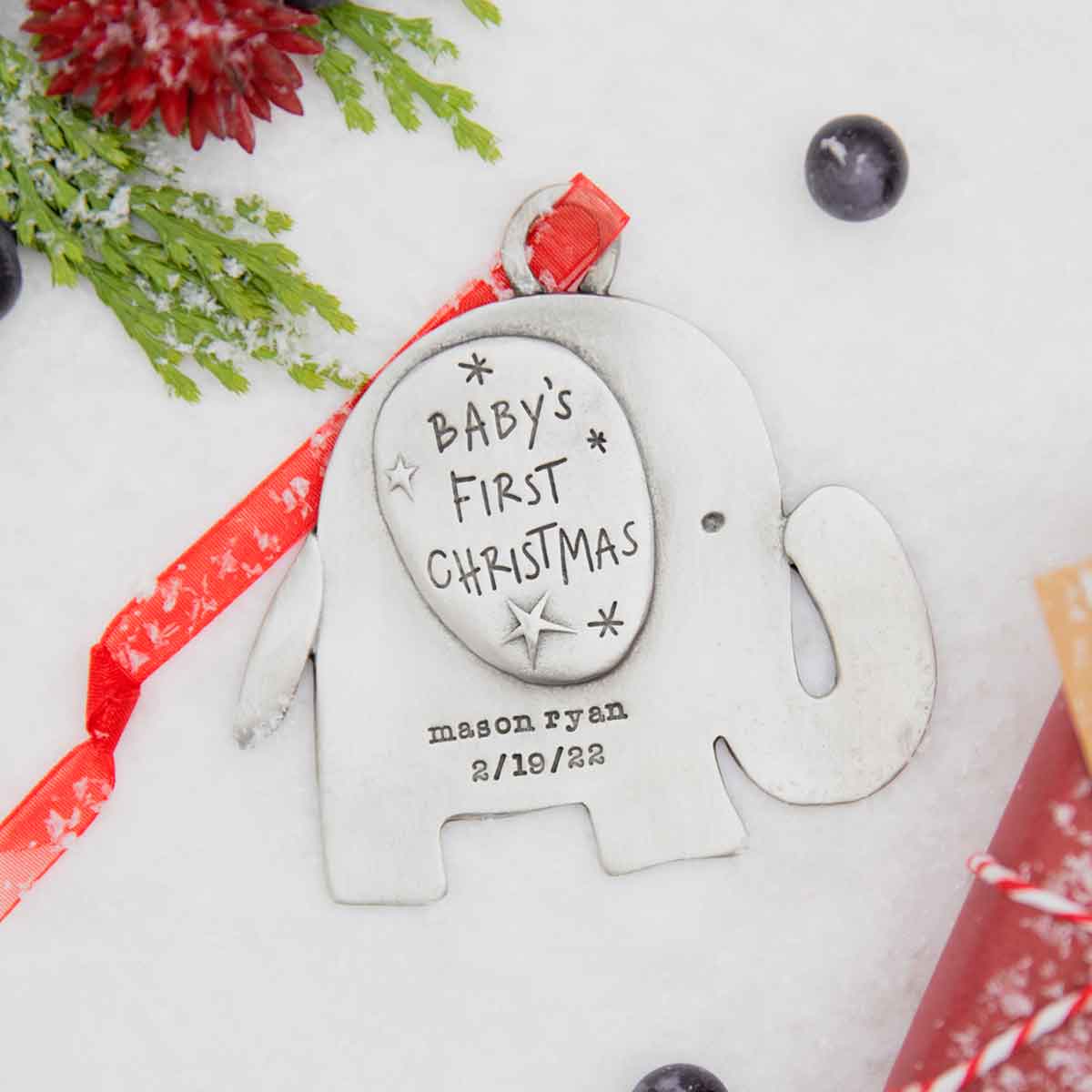 baby's first Christmas ornament of an elephant hand-molded and cast in fine pewter. personalized with up to two lines with a name