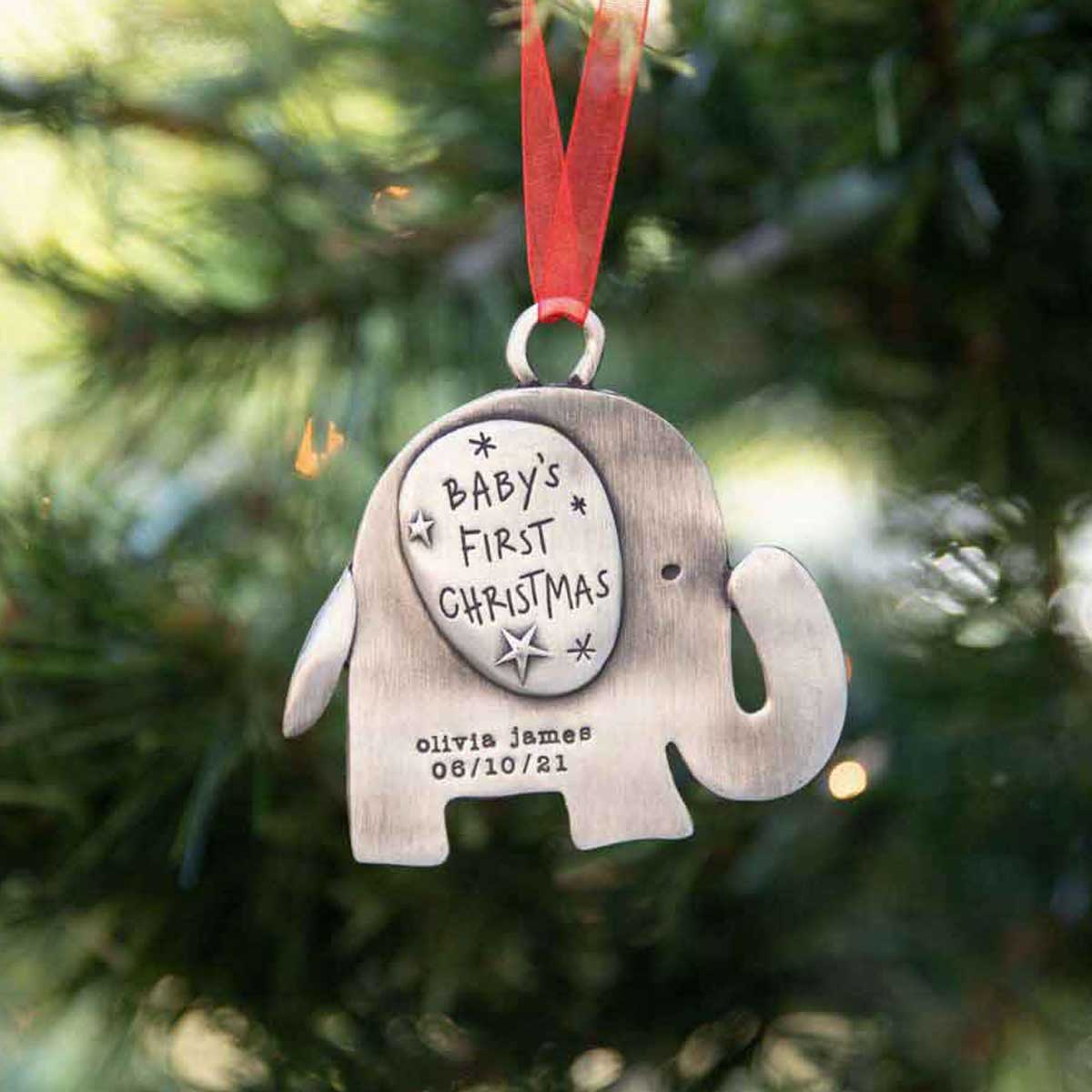 baby's first Christmas ornament of an elephant hand-molded and cast in fine pewter personalized with up to two lines with a name