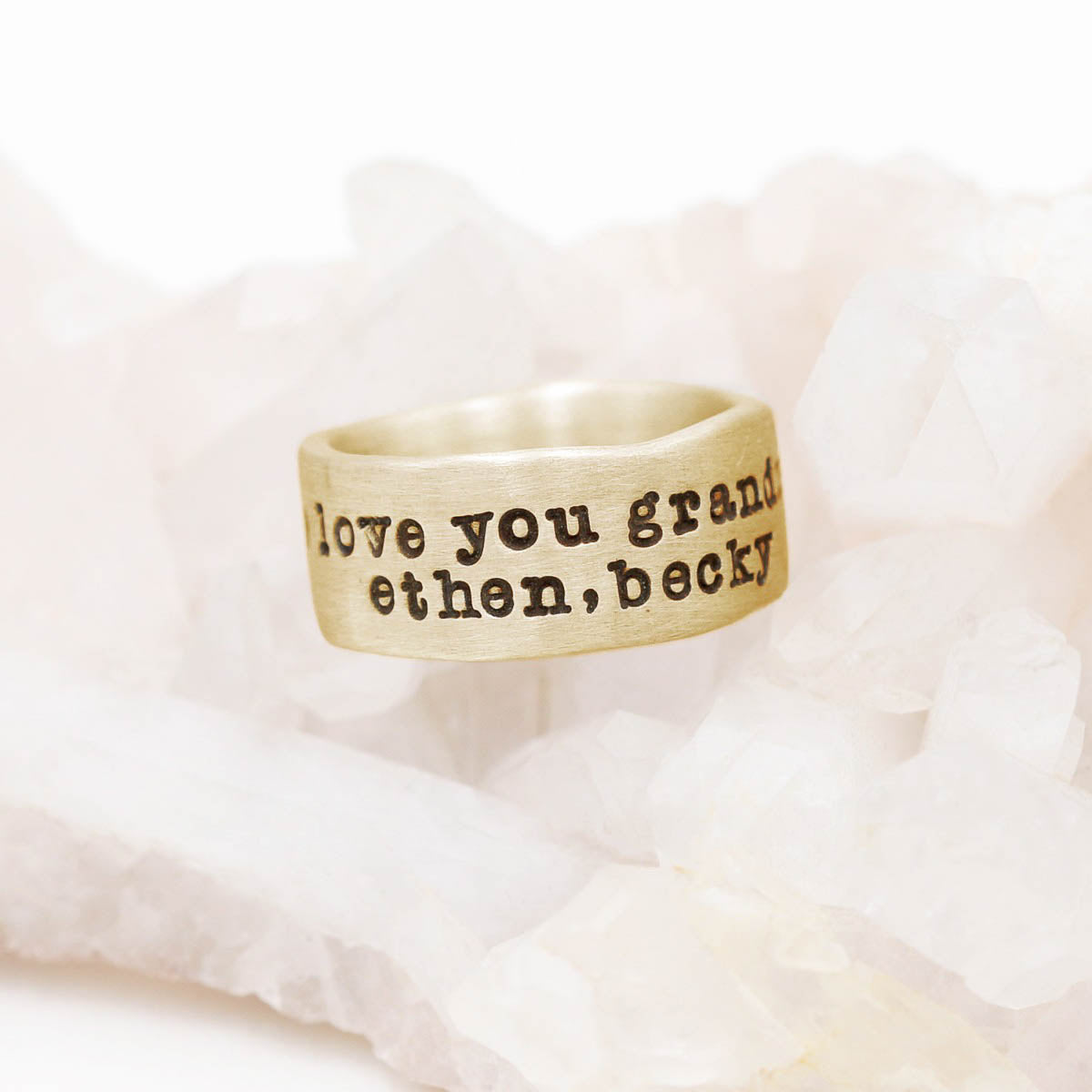 Band together ring handcrafted in 10k yellow gold with an antiqued/satin finish and personalized with words