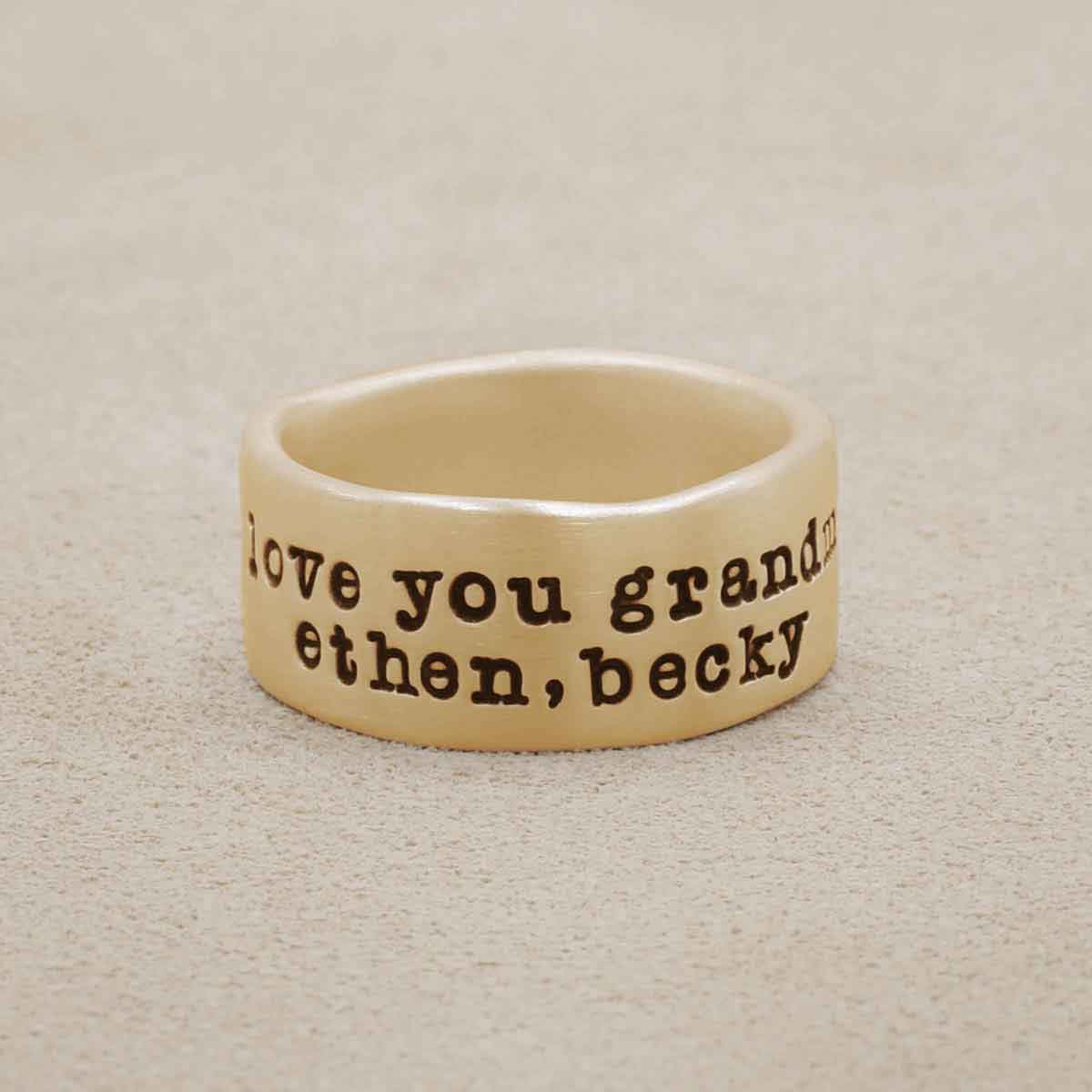 Band together ring handcrafted in 10k yellow gold with an antiqued/satin finish and personalized with words, names, or a quote