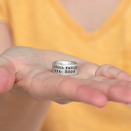 Girl wearing Band together ring handcrafted in sterling silver with an antiqued/satin finish and personalized with words