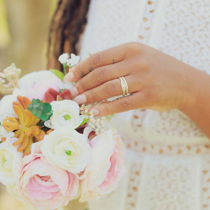 Woman wearing Be mine ring pair hand-molded and cast in 14k yellow gold set with a 3mm birthstone or a diamond 