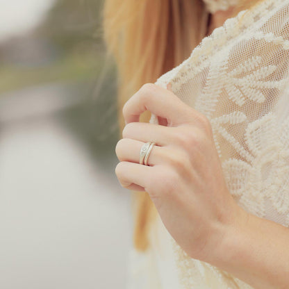 Girl wearing Be mine ring pair hand-molded and cast in sterling silver set with a 3mm birthstone or a diamond