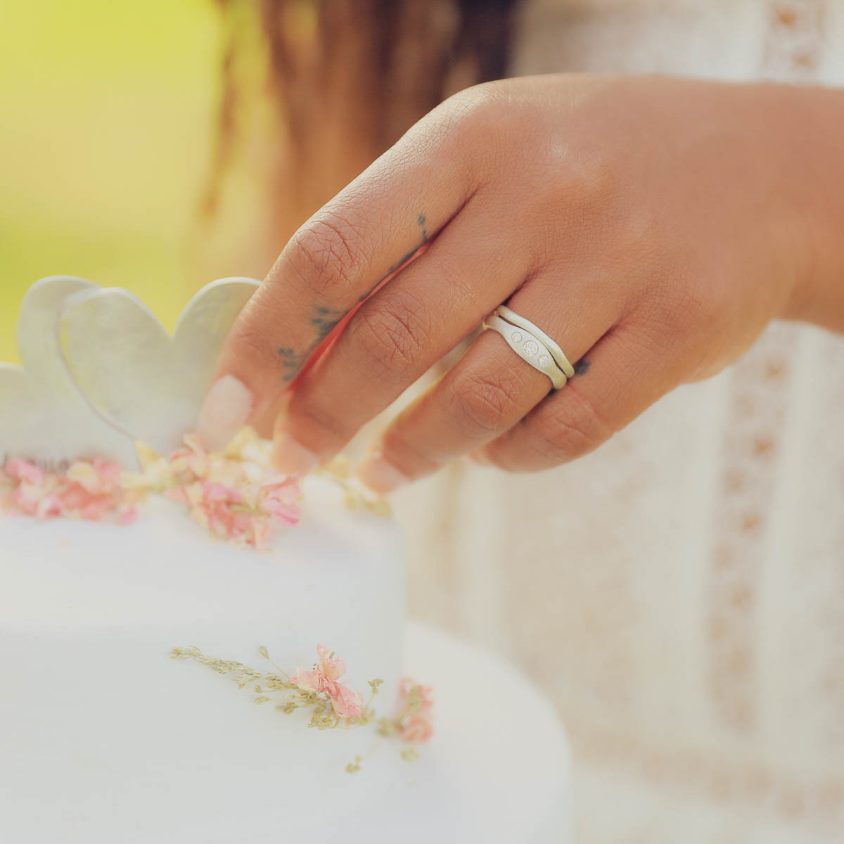 Girl wearing Be mine ring pair hand-molded and cast in sterling silver set with a 3mm birthstone or a diamond