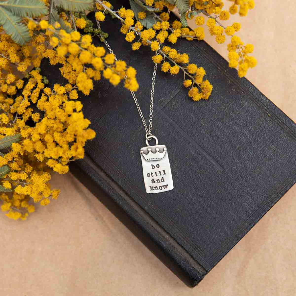 Be still necklace handcrafted in pewter with a matte brushed finish with inscribed message