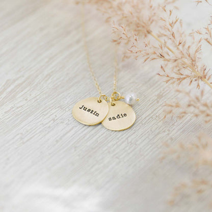 Beloved name disc handcrafted in 10k yellow gold hung with a vintage freshwater pearl and customizable with a name or word