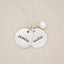 Beloved name disc handcrafted in sterling silver hung with a vintage freshwater pearl and customizable with a name or word