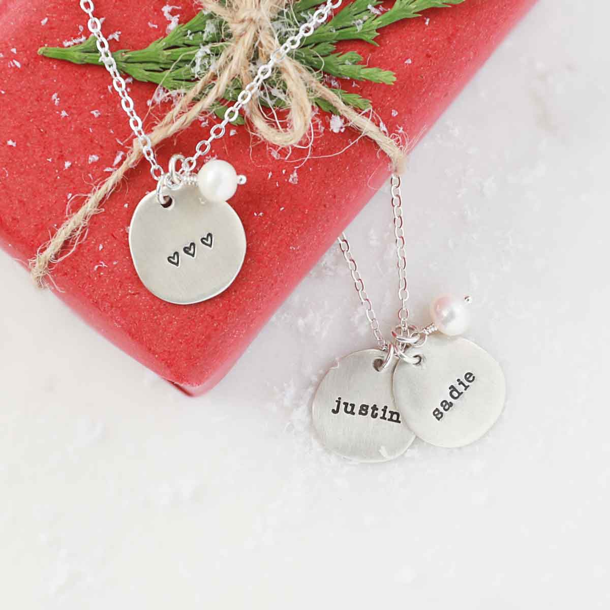 Beloved name disc handcrafted in sterling silver hung with a vintage freshwater pearl and customizable with a name or word