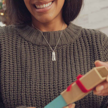 Girl wearing her Bezel birthstone necklace handcrafted in sterling silver with choice of genuine stone or diamond and personalized with a special name