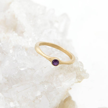 Bezel birthstone ring handcrafted in 10k yellow gold set with a 3mm birthstone inside a gold bezel