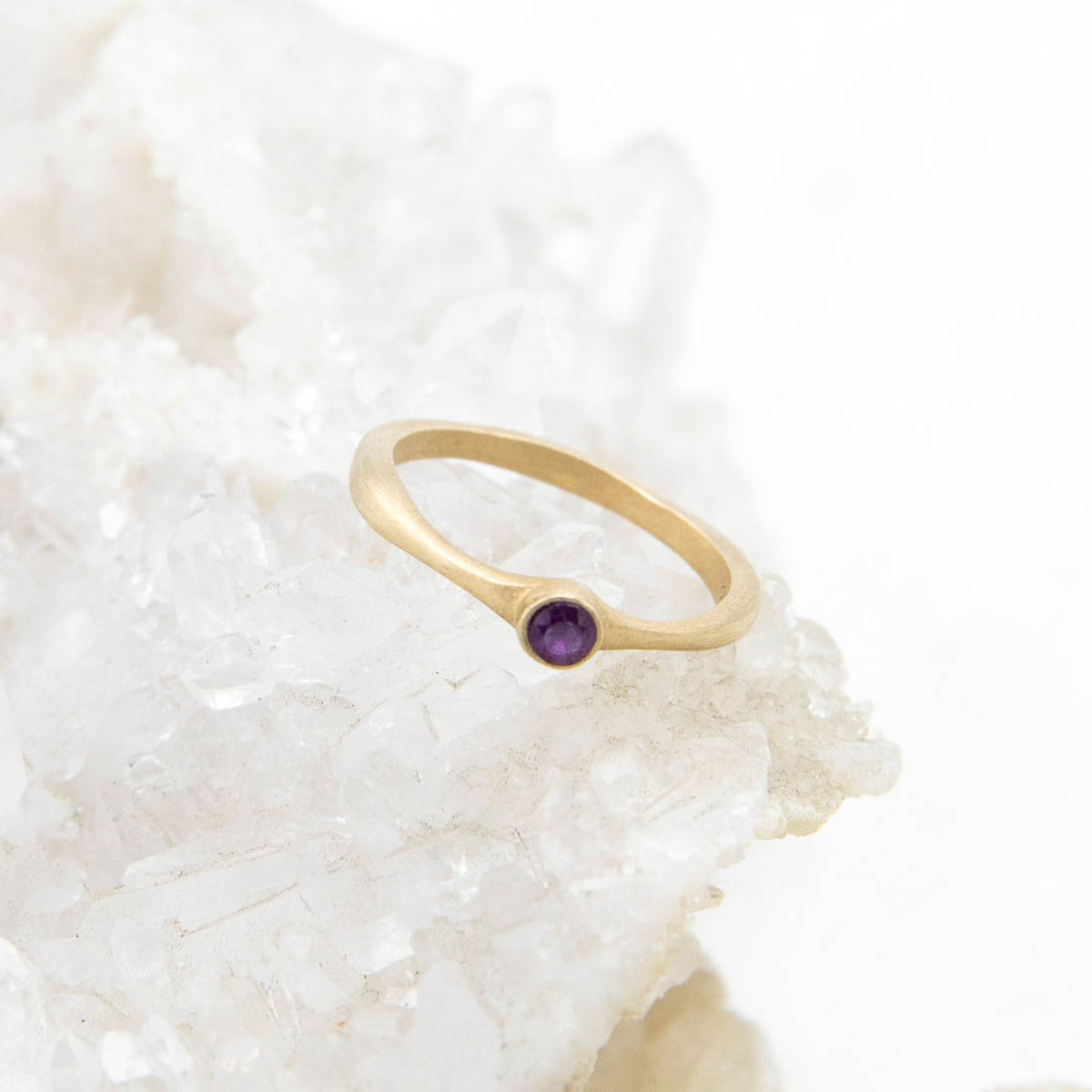 Bezel birthstone ring handcrafted in 14k yellow gold set with a 3mm birthstone inside a gold bezel