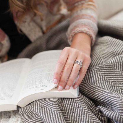 Girl stacking Bezel birthstone rings handcrafted in sterling silver set with a 3mm birthstone inside a sterling bezel