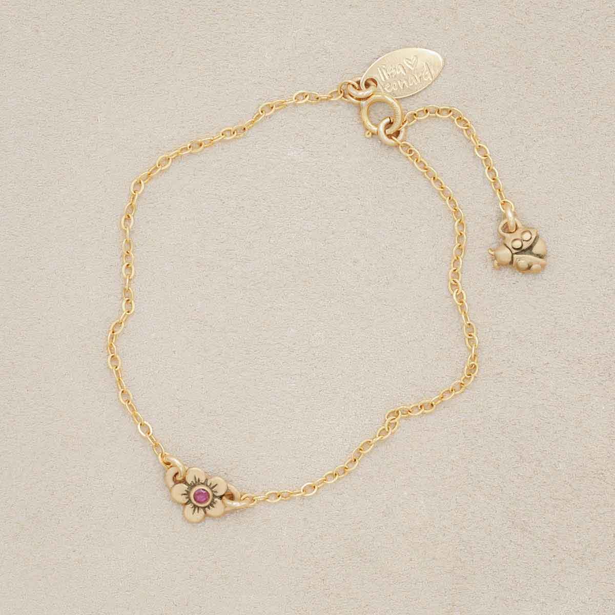 10k gold birthstone bloom bracelet with sweet flower charm and 10k yellow gold lady bug charm