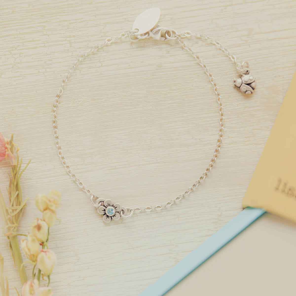 sterling silver birthstone bloom bracelet with sweet flower charm and sterling silver lady bug charm