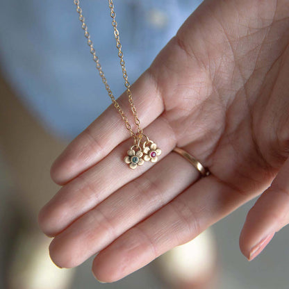 10k yellow gold birthstone bloom necklace with flower charms containing 2mm genuine birthstones 