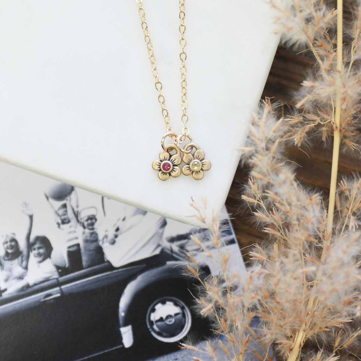 10k yellow gold birthstone bloom necklace with flower charms containing 2mm genuine birthstones 