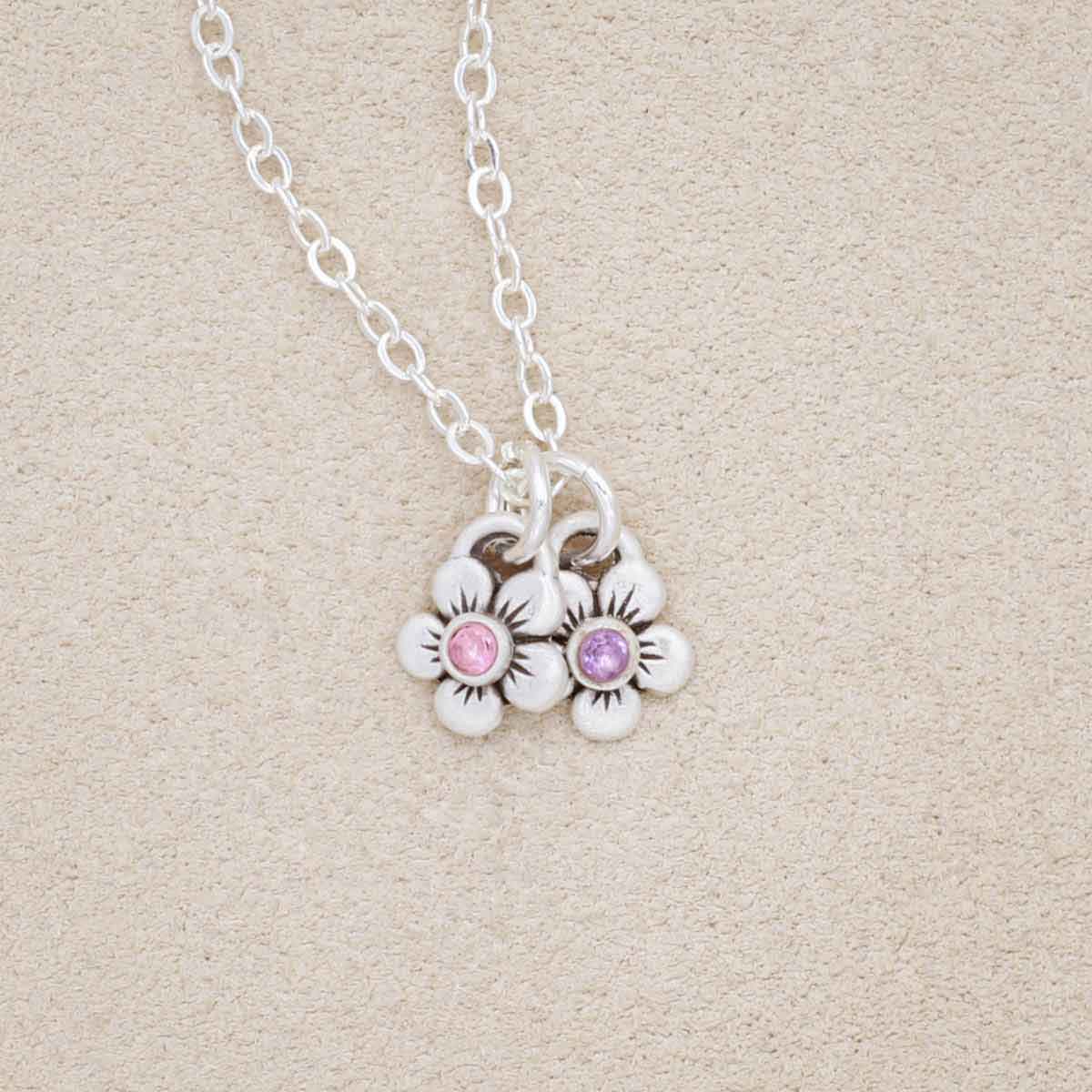 sterling silver birthstone bloom necklace with two flower charms containing 2mm genuine birthstones