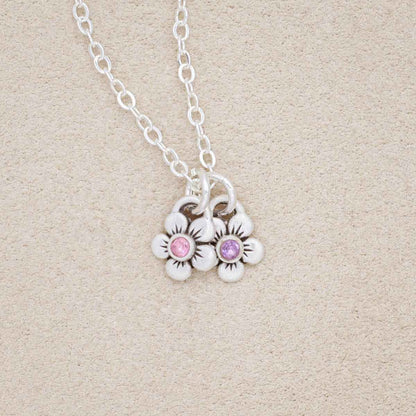 sterling silver birthstone bloom necklace with two flower charms containing 2mm genuine birthstones