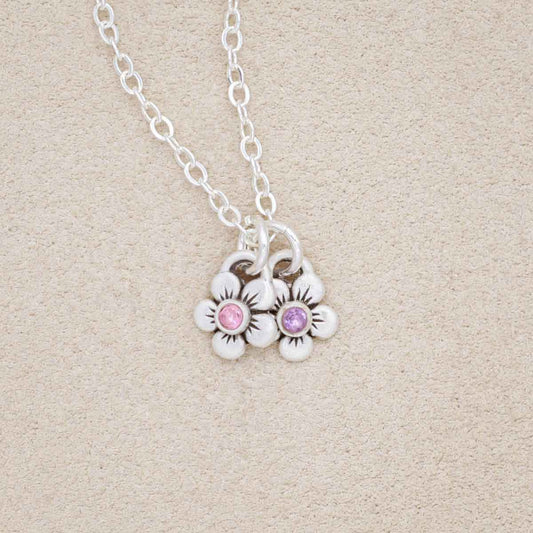 sterling silver birthstone bloom necklace with two flower charms containing 2mm genuine birthstones