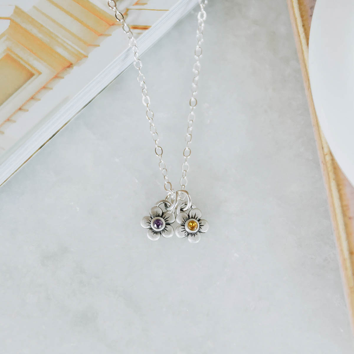 sterling silver birthstone bloom necklace with two flower charms containing 2mm genuine birthstones 