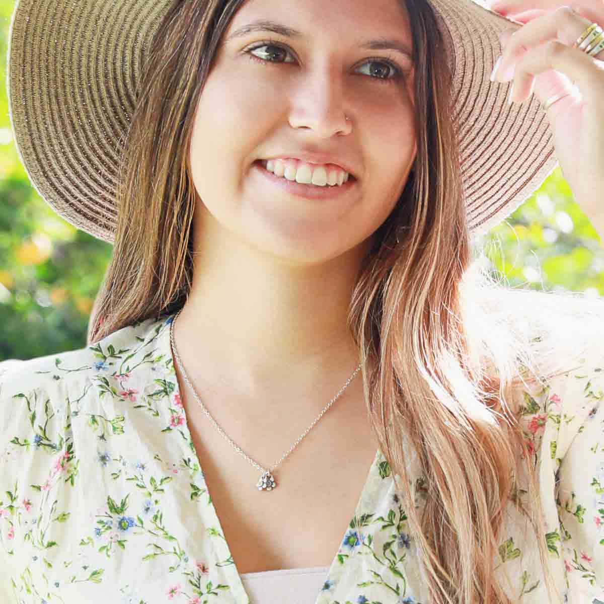 girl wearing sterling silver birthstone bloom necklace with flower charms containing 2mm genuine birthstones 