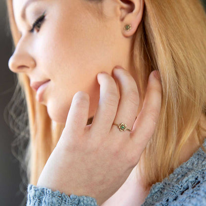 Girl wearing Birthstone bloom ring  handcrafted in 10k yellow gold with an antiqued/satin finish set with a 2mm birthstone