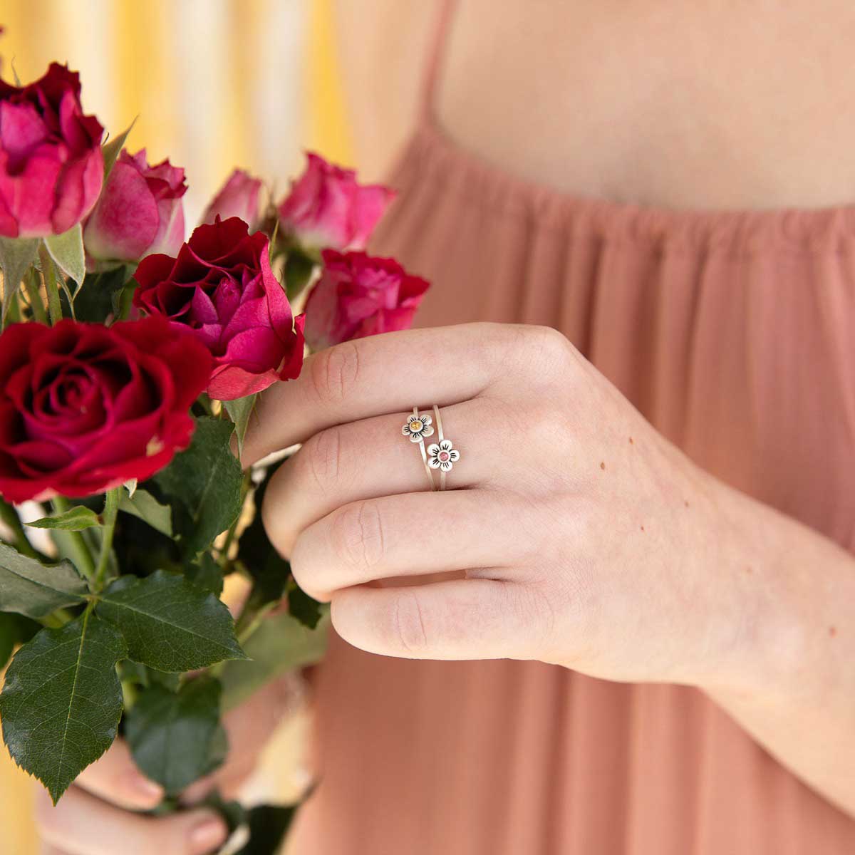 Girl wearing Birthstone bloom ring  handcrafted in sterling silver with an antiqued/satin finish set with a 2mm birthstone