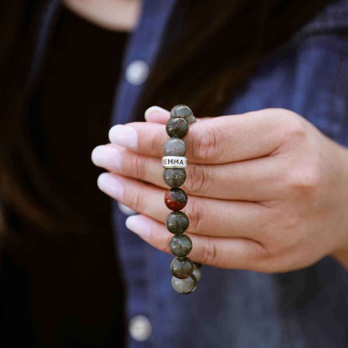 man holding a Blood Stone Beaded Name Bracelet