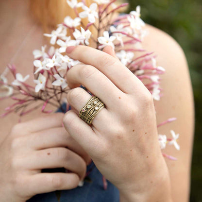 girl wearing brave love birthstone ring handcrafted in 10k yellow gold customizable with up to five 2mm genuine birthstones