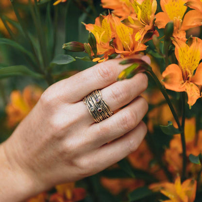 girl wearing brave love birthstone ring handcrafted in 10k yellow gold customizable with up to five 2mm genuine birthstones