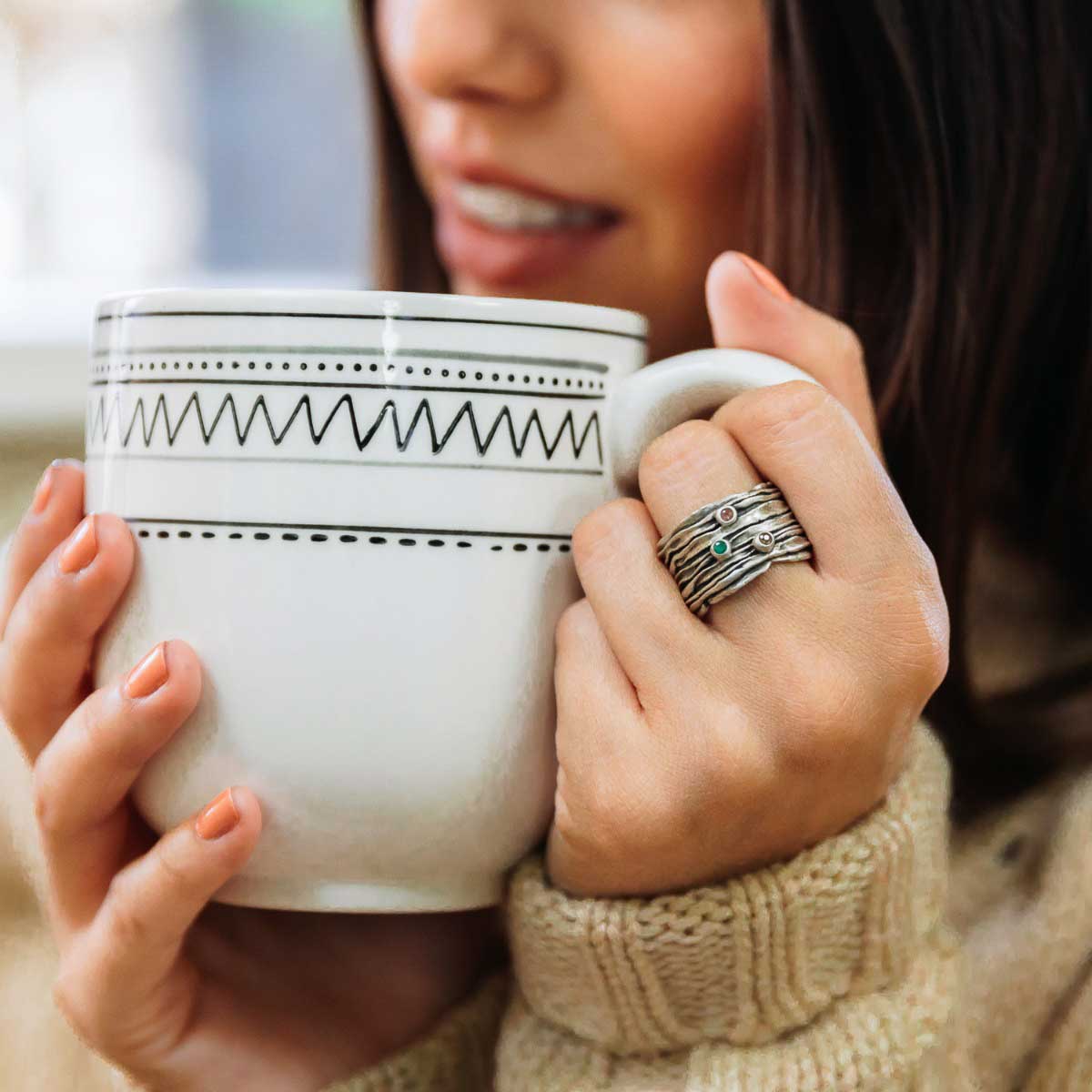 woman wearing brave love birthstone ring handcrafted in sterling silver customizable with up to five 2mm genuine birthstones