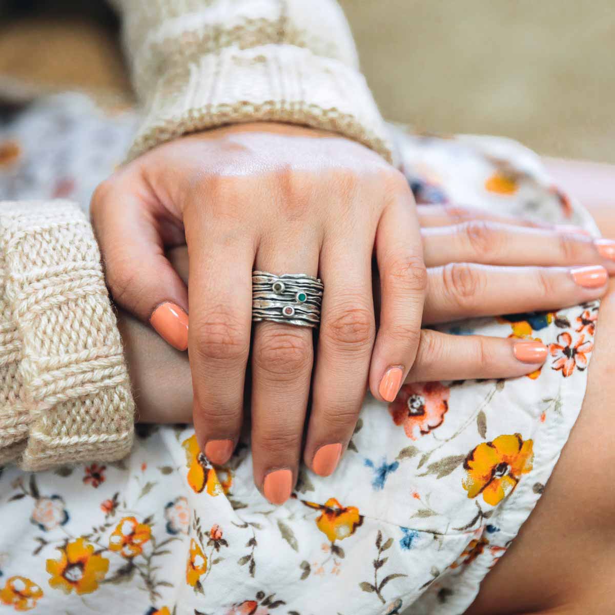 woman wearing brave love birthstone ring handcrafted in sterling silver customizable with up to five 2mm genuine birthstones