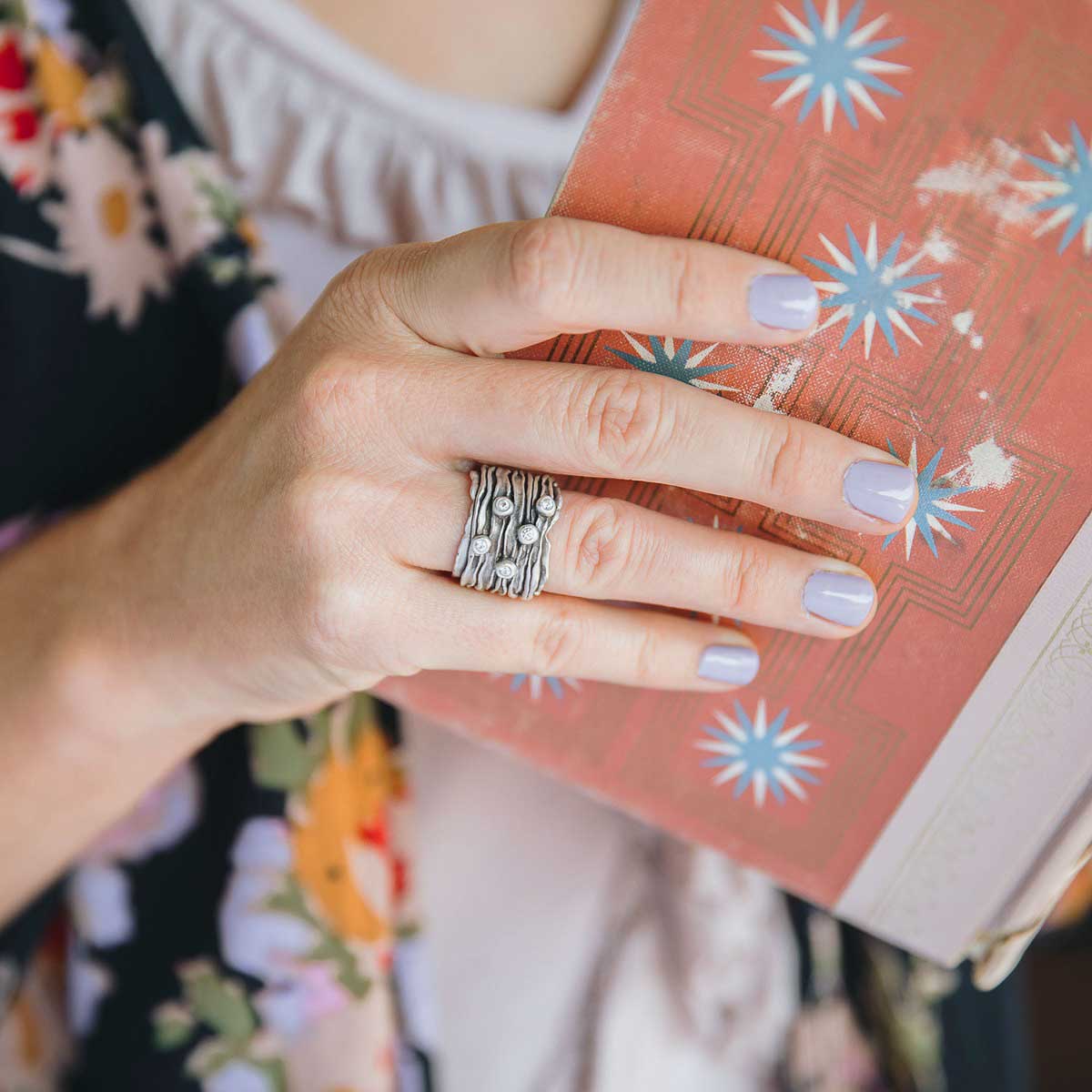 woman wearing brave love birthstone ring handcrafted in sterling silver customizable with up to five 2mm genuine birthstones