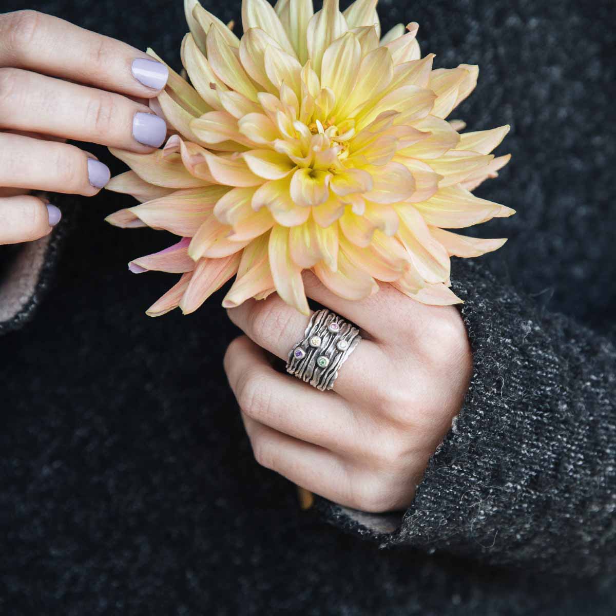 woman wearing brave love birthstone ring handcrafted in sterling silver customizable with up to five 2mm genuine birthstones