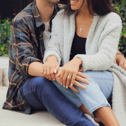 girl wearing brave love spinner ring gold sitting with boyfriend