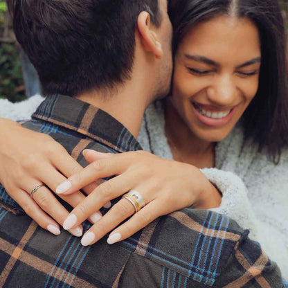 girl wearing brave love spinner ring gold hugging boyfriend