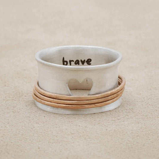 brave love® spinner ring {sterling silver & bronze} on suede background