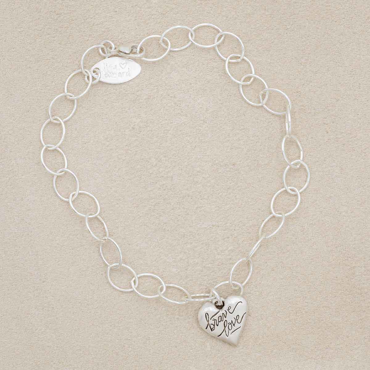 Sterling silver Brave Love emblem bracelet with a matte brushed finish